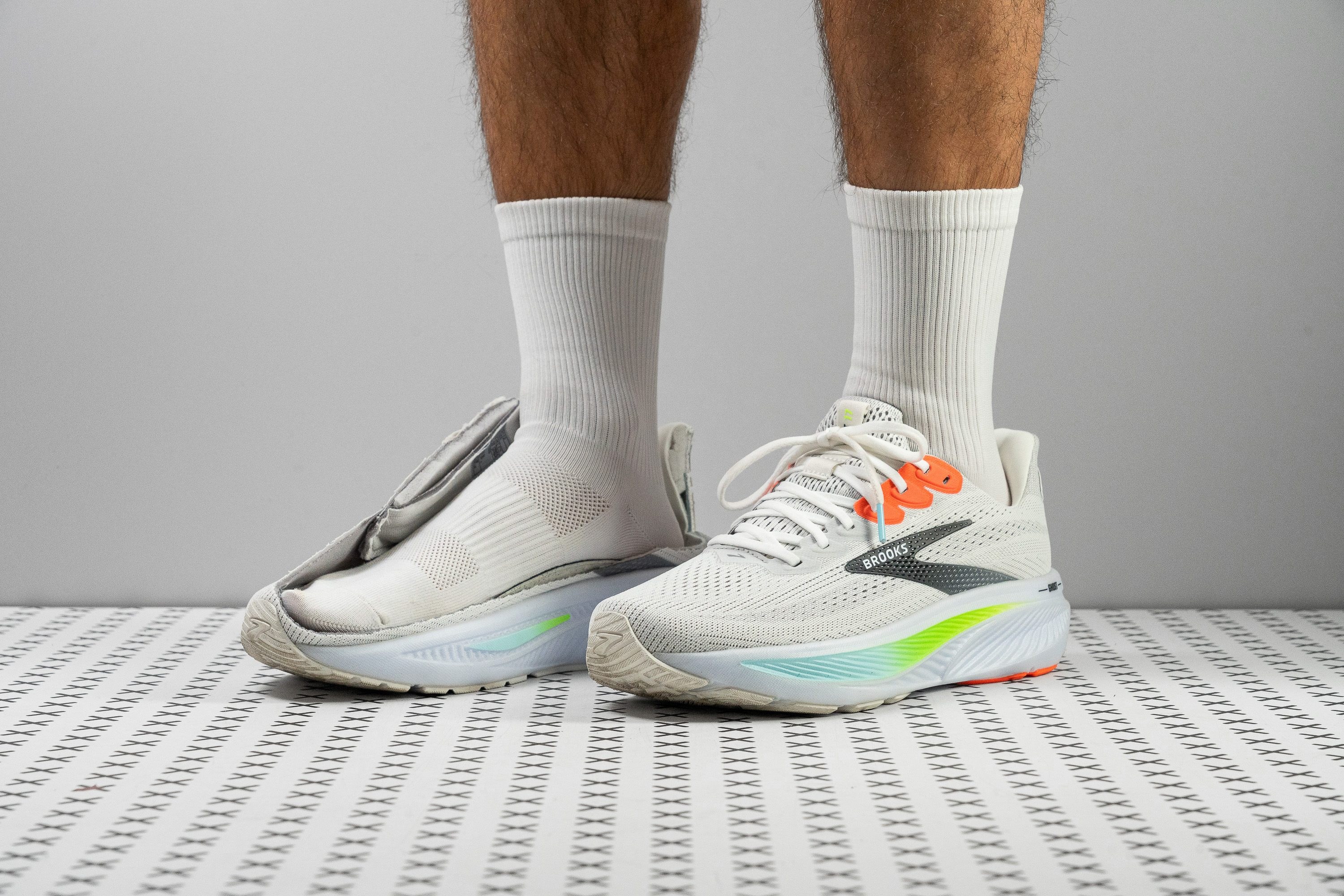 Colorful running shoes arranged in a flat lay on a white surface