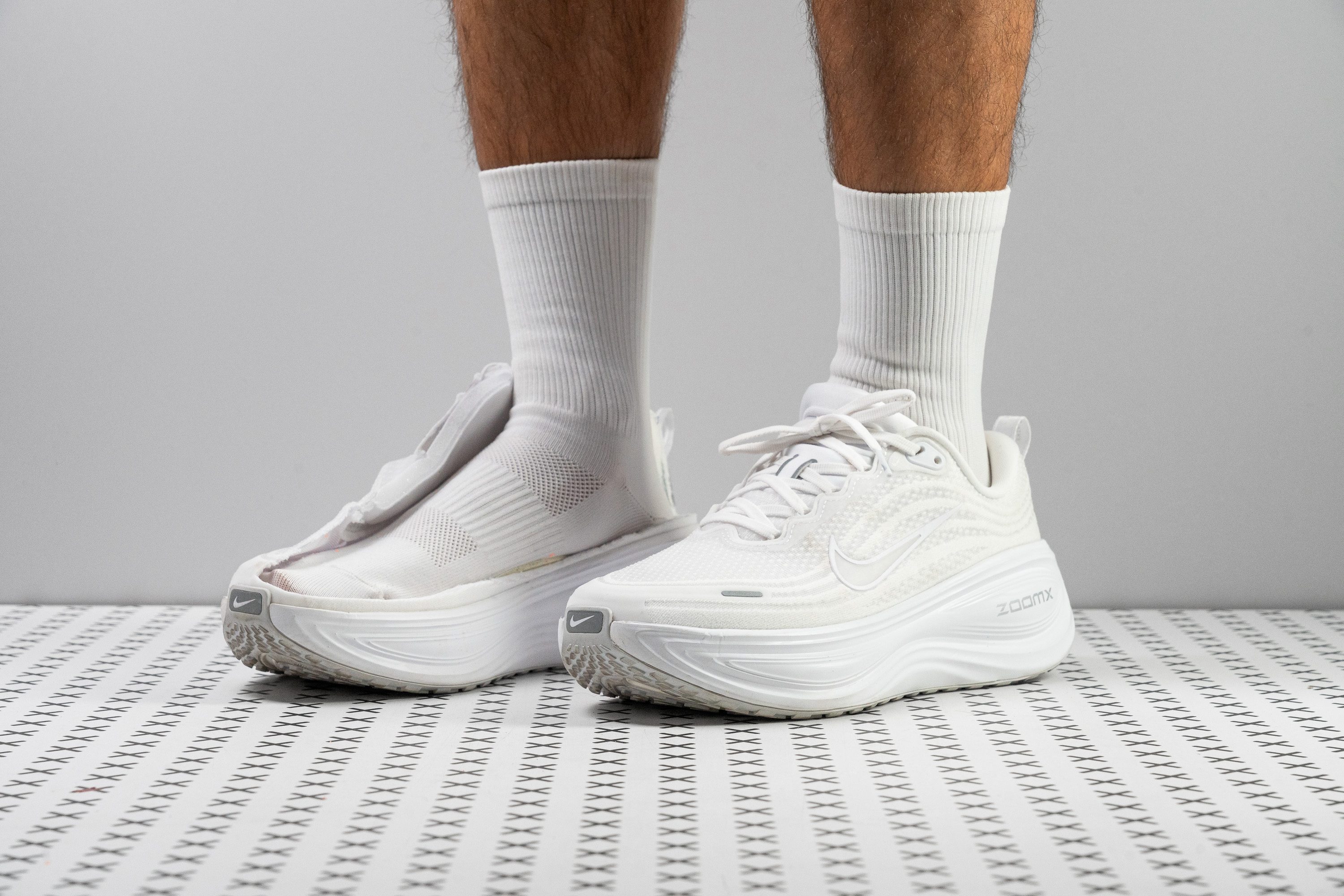 Nike Vomero Plus running shoe from the side showing the thick ZoomX midsole